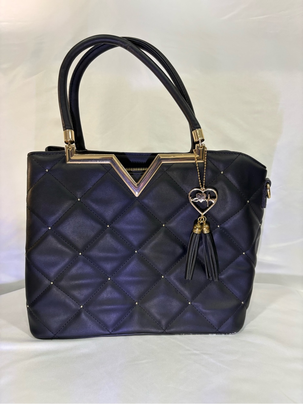 Quilted Black Tote with Gold V Accent and Tassel Charm